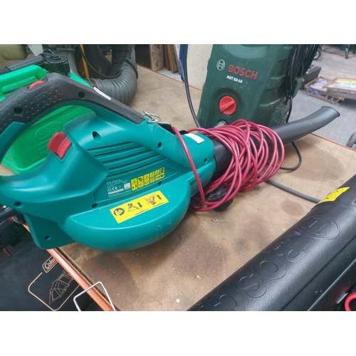 1286 - Two green Bosch electric power tools, one AQT33-10 pressure washer with hose and lance and one ALS30... 