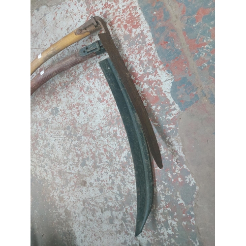 1289 - Two vintage wooden shafted scythes