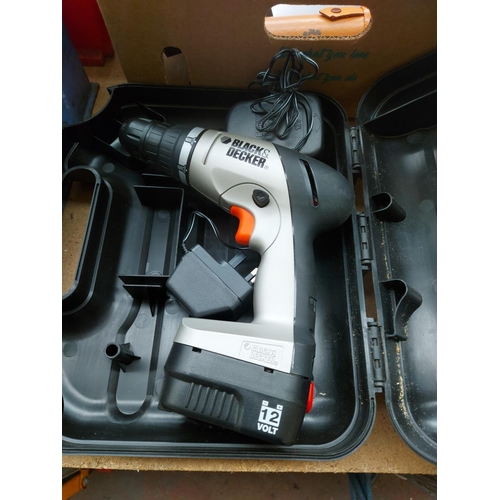 1328 - Two items to include, one cased black and silver Black & Decker HP12 cordless drill with battery and... 