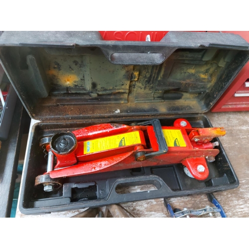 1339 - Four motoring items including cased Hilka 2000 kilo trolley jack, twin cylinder foot pump, one pair ... 