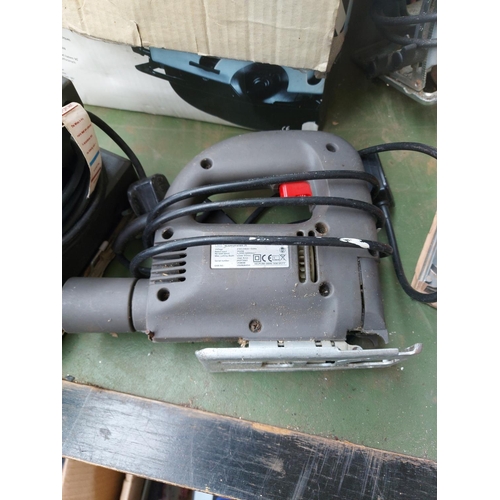 1341 - A mixed lot to include one green Bosch PKS46 hand held electric circular saw, one blue Black & Decke... 