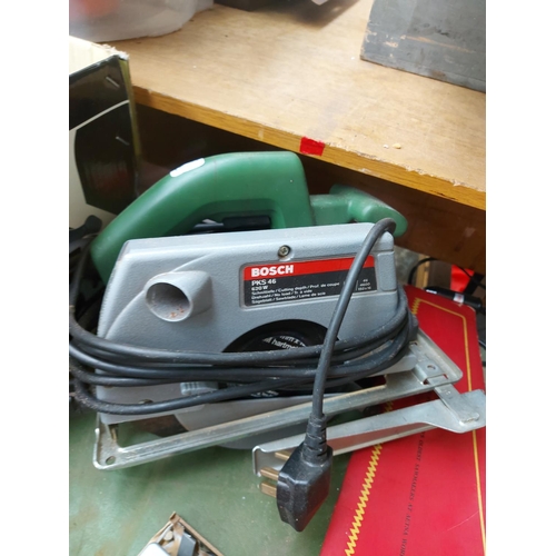 1341 - A mixed lot to include one green Bosch PKS46 hand held electric circular saw, one blue Black & Decke... 