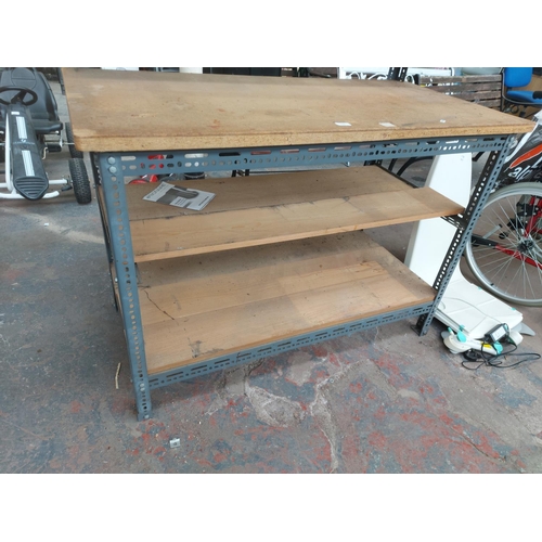 1352 - A wood and metal work bench - approx. 1.30m high x 1.30m wide x 64cm deep