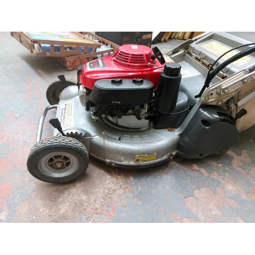 1356 - A red and silver Lawn Flight Pro 553 HRS petrol lawn mower with Honda GXP160 engine and grass collec... 