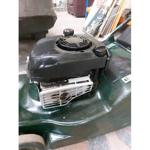 1359 - A black and green Hater Harrier 48 petrol lawn mower with Briggs & Stratton engine and grass collect... 