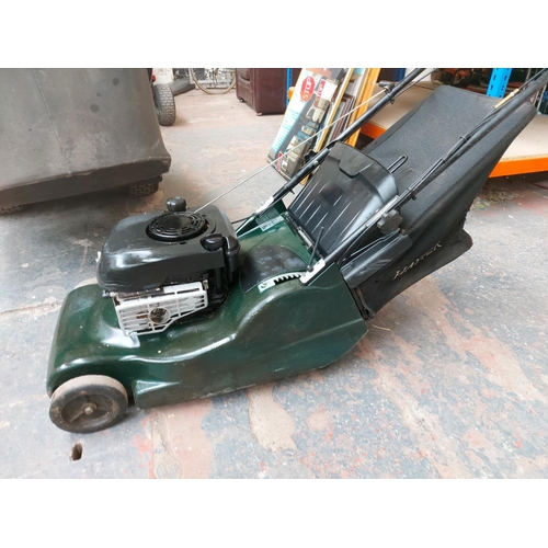 1359 - A black and green Hater Harrier 48 petrol lawn mower with Briggs & Stratton engine and grass collect... 