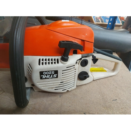 1369 - An orange and cream petrol chainsaw with 18