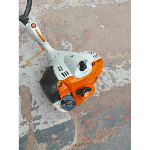 1373 - An orange and grey Stihl FS40-c petrol strimmer