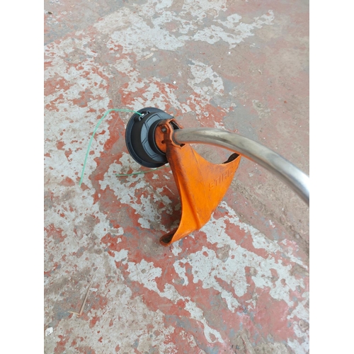 1377 - An orange and grey Stihl FS40-c petrol strimmer