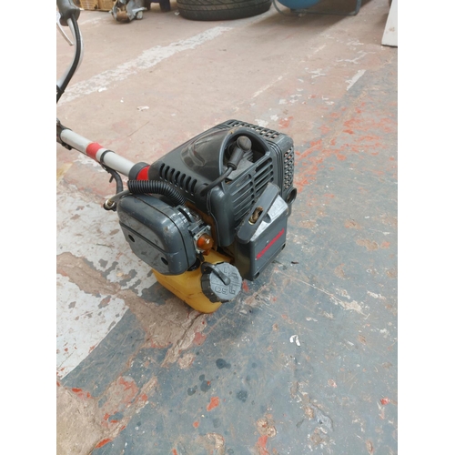 1379 - A red and grey Kawasaki KBH43A petrol strimmer