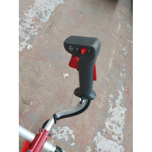 1379 - A red and grey Kawasaki KBH43A petrol strimmer