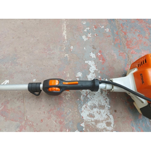 1380 - An orange and grey Stihl long reach petrol hedge trimmer with 20