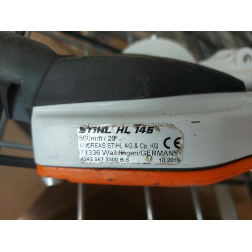 1380 - An orange and grey Stihl long reach petrol hedge trimmer with 20