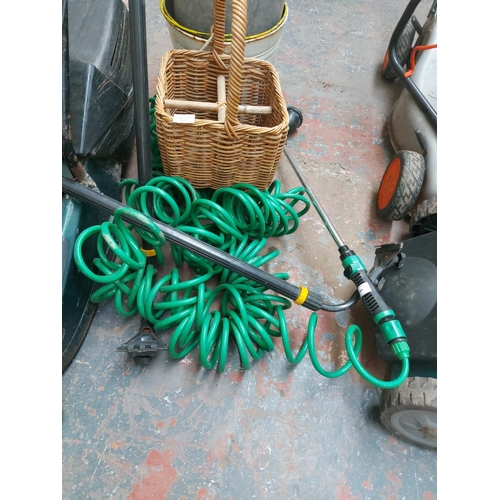 1386 - A mixed lot to include black and green Hater DVS153 petrol lawnmower with grass collector, garden ra... 