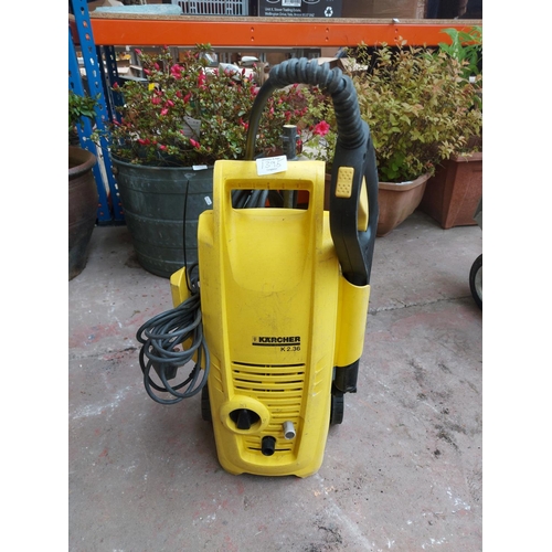 1395 - Two items, one black and yellow Karcher 2.36 electric pressure washer with hose and lance and one or... 