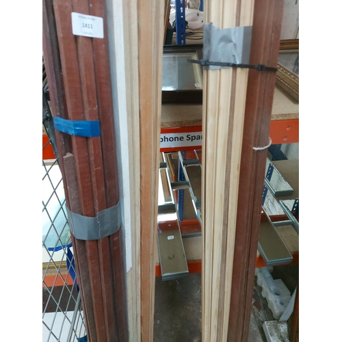 1411 - A large quantity of hard and soft wood finishing trims