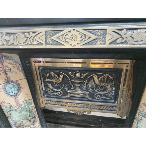 1416 - A cast iron fireplace insert with decorative tiles - approx. 38