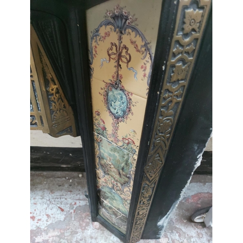 1416 - A cast iron fireplace insert with decorative tiles - approx. 38