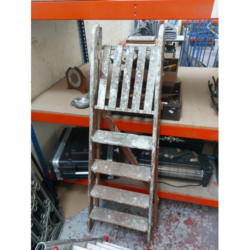 1424 - Three items, one aluminium multipurpose ladder and two sets of wooden step ladders, one three tread ... 