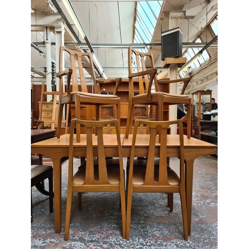 749 - A Nathan teak extending dining table and six matching chairs - approx. 75cm high x 92cm wide x 153cm... 