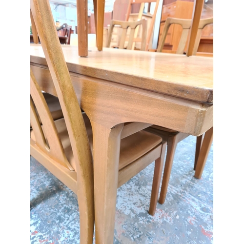 749 - A Nathan teak extending dining table and six matching chairs - approx. 75cm high x 92cm wide x 153cm... 