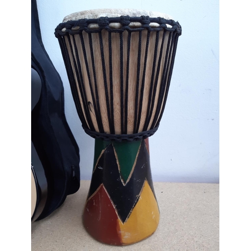 1126 - Three items, one rope tuned djembe hand drum with natural skin, one cased Jose Ferrer El Primo ½ siz... 