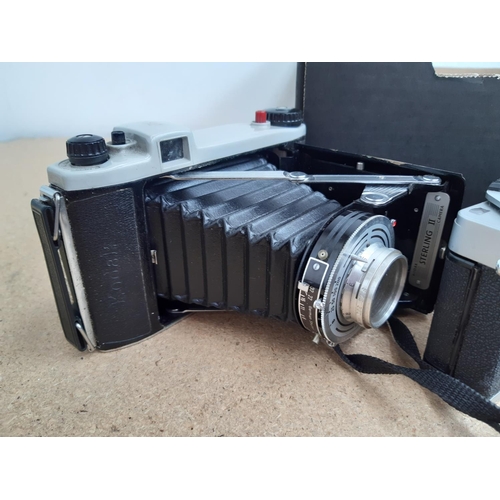 1186 - A box containing cameras and photography equipment to include Praktica LTL3, Olympus Trip 35,  late ... 