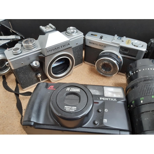 1186 - A box containing cameras and photography equipment to include Praktica LTL3, Olympus Trip 35,  late ... 