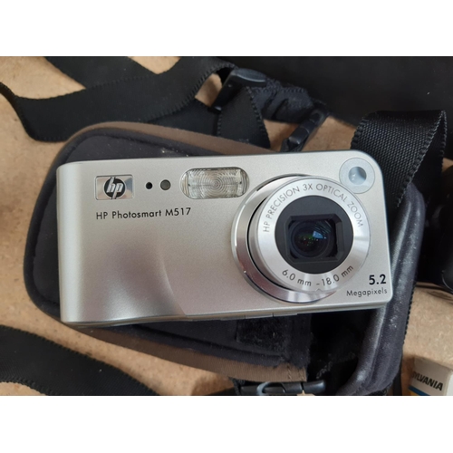 1187 - A box containing cameras and photography equipment to include HP Photosmart M517 digital camera, Boo... 