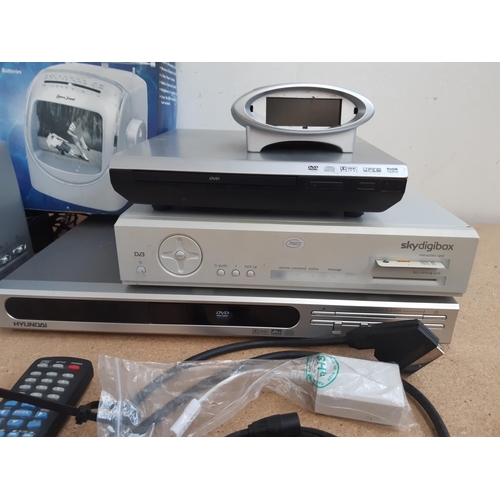 1057 - A box containing Pace Sky Digi box, Hyundai 320A DVD player, Tesco DPA08 DVD player, boxed Lenoxx So... 