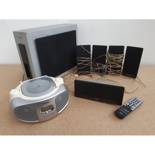 1058 - A box containing Phillips 5.1 AV speaker system and Philips AZ102S portable CD radio