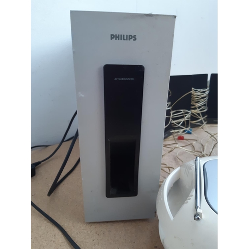 1058 - A box containing Phillips 5.1 AV speaker system and Philips AZ102S portable CD radio