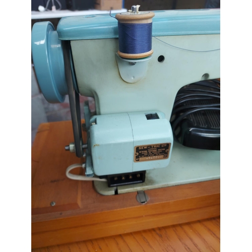 1136 - A cased vintage Brother blue and green enamel electric sewing machine with foot pedal