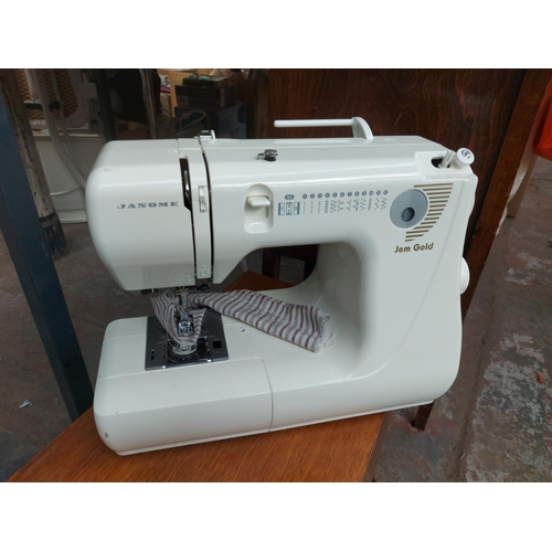 1138 - Two items, one white Janome Jem Gold electric sewing machine and one wooden box containing cotton an... 