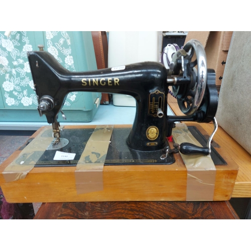 1140 - Two items, one vintage Singer 99K manual sewing machine and one oak sewing cabinet