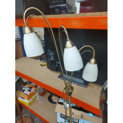 1150 - A large lighting lot to include brushed brass triple standard lamp, brass and porcelain table lamps ... 