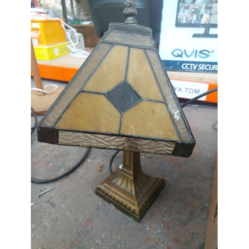 1150 - A large lighting lot to include brushed brass triple standard lamp, brass and porcelain table lamps ... 