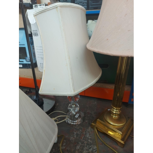 1151 - Six items, two pairs of brass table lamps with shades, one unusual triple bird feeder and one plasti... 