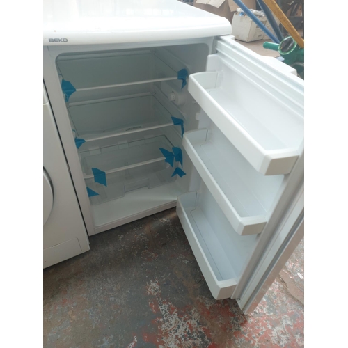 1176 - A Beko 55cm under counter fridge