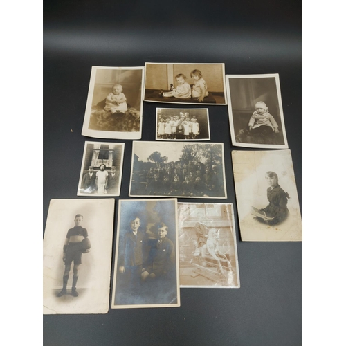 322 - A large collection of mostly 19th/early 20th century black and white photographs to include sports, ... 