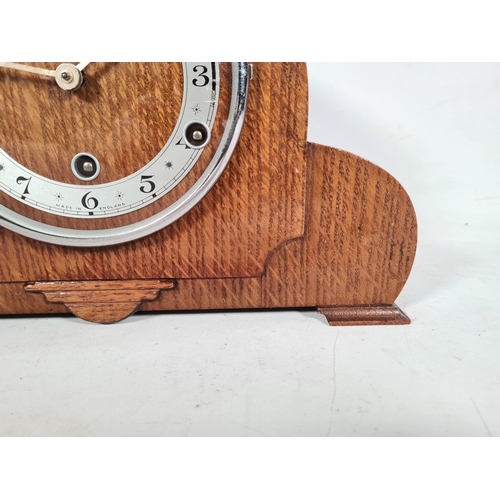 503 - A 1930s oak cased Westminster chime mantle clock with key & pendulum