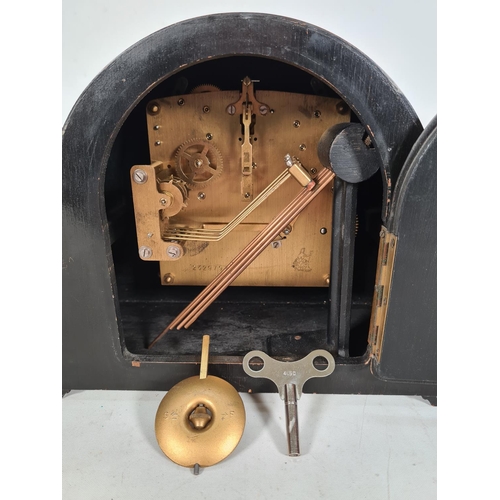 503 - A 1930s oak cased Westminster chime mantle clock with key & pendulum