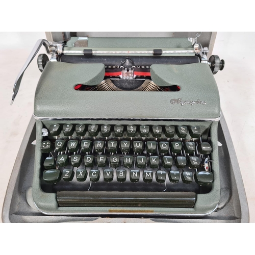 510 - A vintage cased green metal Olympia typewriter