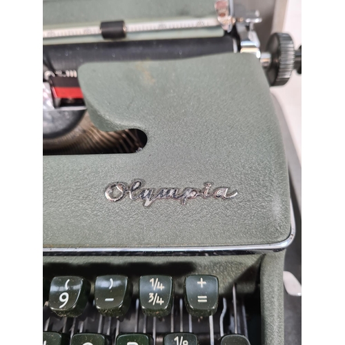 510 - A vintage cased green metal Olympia typewriter