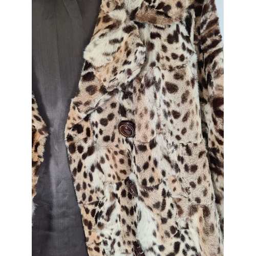 515 - A late 1940s/ early 1950s ladies leopard skin jacket with silk lining