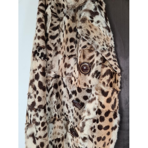 515 - A late 1940s/ early 1950s ladies leopard skin jacket with silk lining