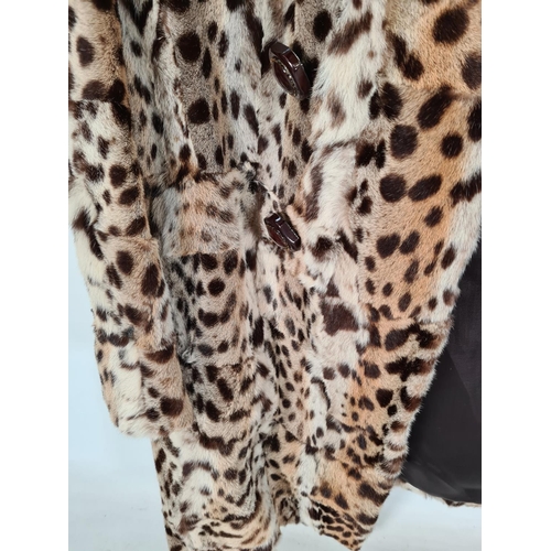 515 - A late 1940s/ early 1950s ladies leopard skin jacket with silk lining