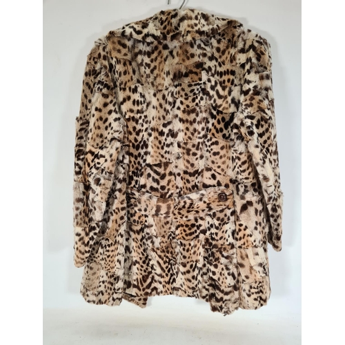 515 - A late 1940s/ early 1950s ladies leopard skin jacket with silk lining