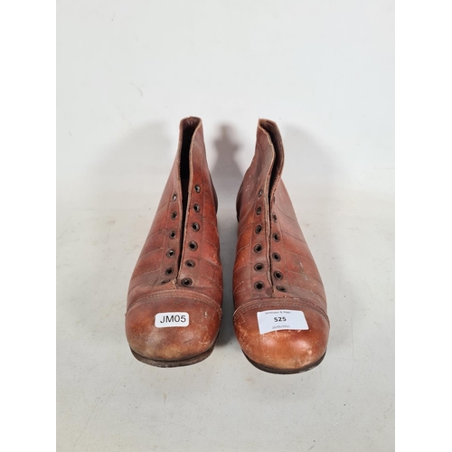 525 - A pair of 1940s/50s brown leather football boots with leather nailed soles and studs