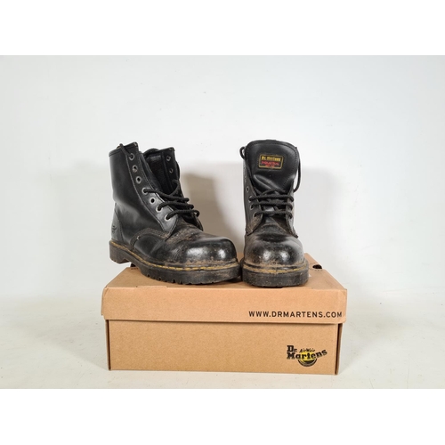 526 - A pair of new Dr Martens black leather steel toe capped size 7 boots